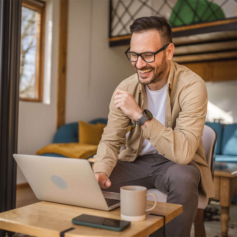 Man Researching On Laptop
